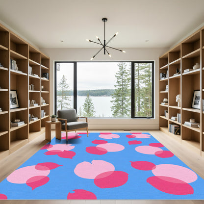 Pink Petal Scatter on Blue Rug