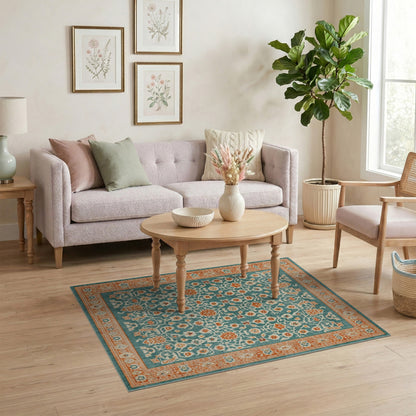 Teal Floral Vintage Area Rug with Orange Accents